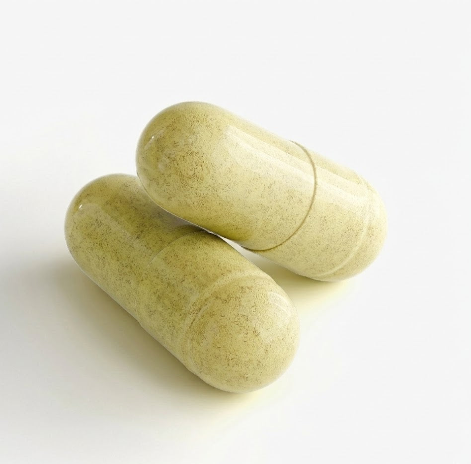 Two green capsules on a white background